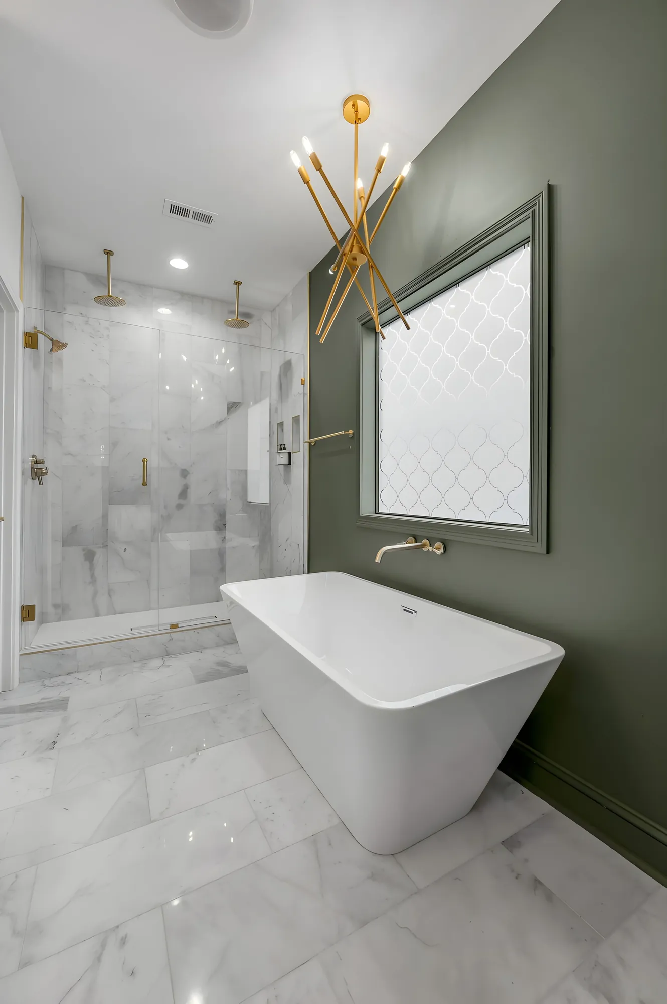 Primary bath at 341 Sherman with a freestanding tub, a glass shower, and brass fittings